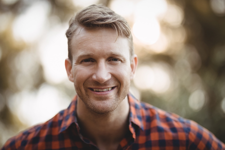 Close up portrait of smiling young man at farmの写真素材