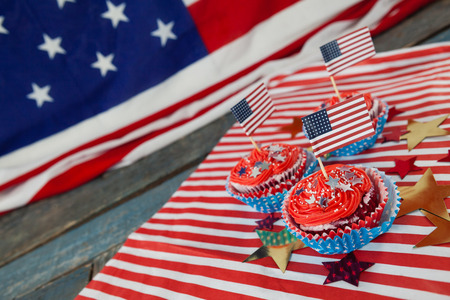 Decorated cupcakes with 4th July theme on wooden tableの写真素材