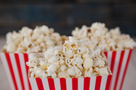 Close-up of popcorn arranged on wooden table with 4th July themeの写真素材