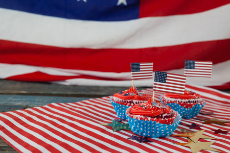 Decorated cupcakes with 4th July theme on wooden tableの写真素材