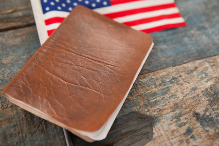 Close-up of visa and American flag on a wooden tableの写真素材