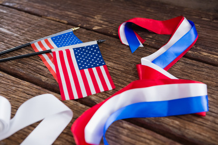 American flags and various ribbons arranged on tableの写真素材