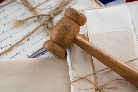 Close-up of gavel on legal documents