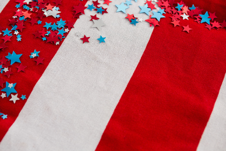Star shape decoration arranged on American flag with 4th July themeの写真素材