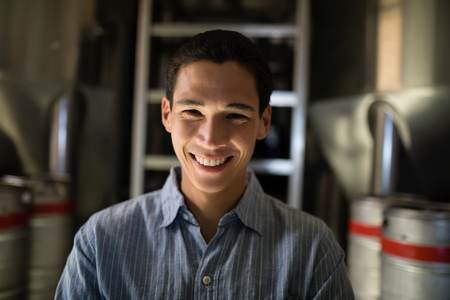 Portrait of manager standing in warehouse of restaurantの写真素材