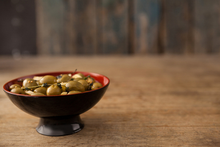 Bowl of olives on table with copy spaceの写真素材