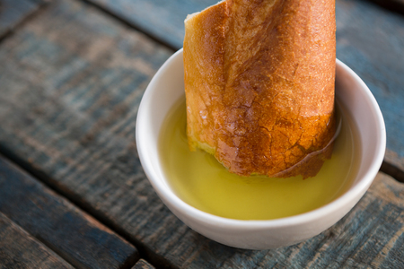 Close-up of bread soaked in olive oilの写真素材
