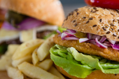 Extreme close up of burger with French friesの写真素材