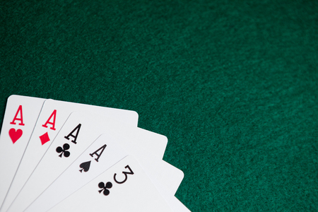 Playing cards arranged on poker table in casino