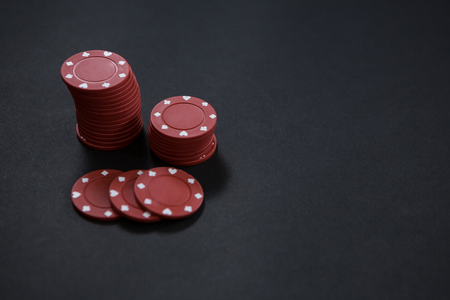 High angle view of maroon chips on table at casino