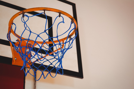 Low angle view of blue basket ball hoop in courtの写真素材
