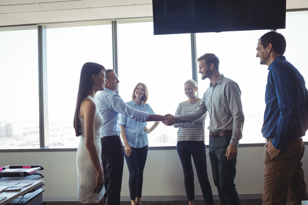 Business people shaking hands at officeの写真素材