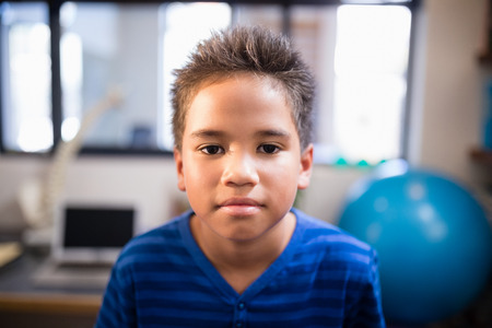 Close-up portrait of boy at hospital ward