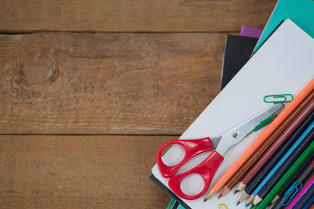 Close-up of various school supplies on wooden tableの写真素材