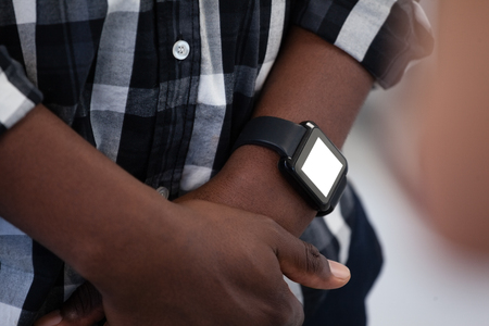 Mid-section of man wearing smartwatchの写真素材