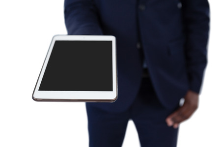 Mid section of businessman holding digital tabletの写真素材
