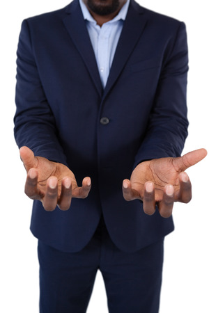 Mid section of helpless businessman showing his handsの写真素材