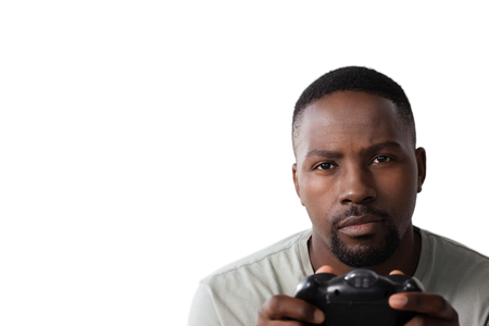 Close-up of man playing video game against white backgroundの写真素材