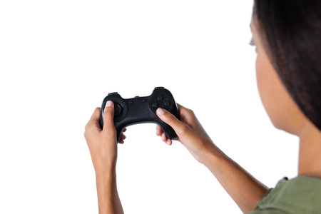 Beautiful woman playing video game against white background