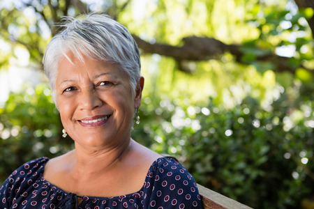 Portrait of senior woman at the parkの写真素材