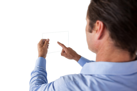 High angle view of businessman using glass interface against white backgroundの写真素材