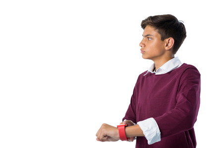 Teenage boy using smartwatch against white background