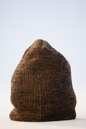 Close-up of wooly hat against white background
