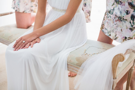 Mid-section of bride in wedding ring at homeの写真素材