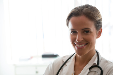 Portrait of confident female doctor standing in nursing homeの写真素材