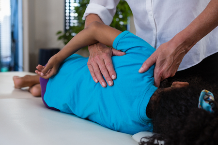 Physiotherapist giving hand massage to a patient in clinicの写真素材