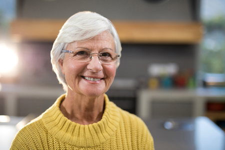 Close-up of smiling senior woman looking at cameraの写真素材