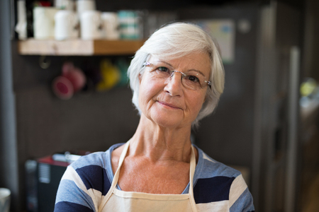Portrait of senior woman in the kitchenの写真素材