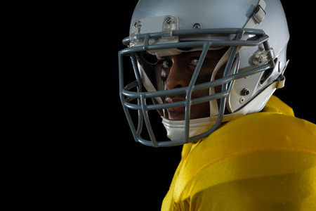 Close-up of American football player with a head gearの写真素材