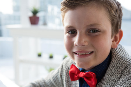 Close up portrait of smiling businessman in officeの写真素材