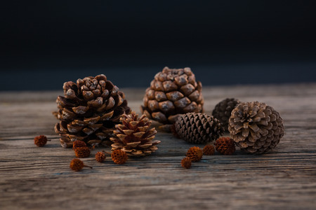 Close up of pine cones on wooden tableの写真素材
