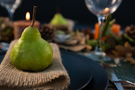 Close up pf pear served on burlap in plate at tabeの写真素材