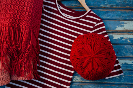 Overhead view of womenswear on wooden tableの写真素材