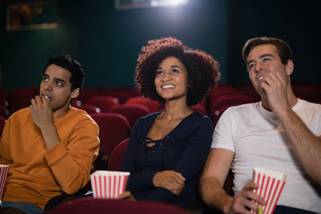 Group of people watching movie in theatreの写真素材