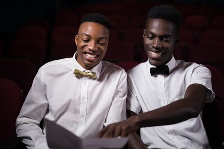 Friends watching movie in theatre