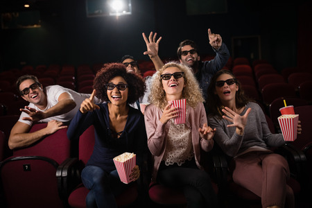 Group of people watching movie in theatreの写真素材