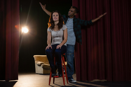 Artists rehearsing on stage in theatreの写真素材