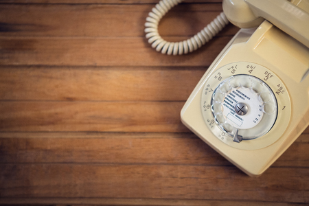 Close up of landline phone on wooden tableの写真素材