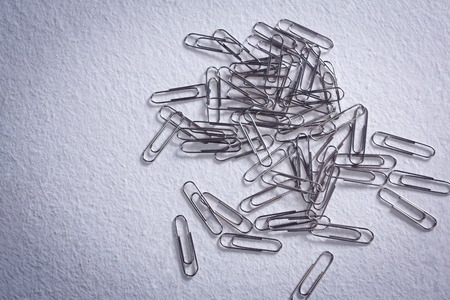 Close-up of paper clips on white backgroundの写真素材