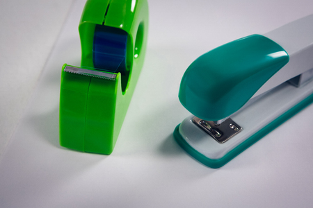 Close-up of stapler and cello tape on white backgroundの写真素材