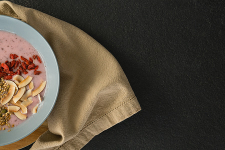 Healthy breakfast in bowl on a concrete backgroundの写真素材