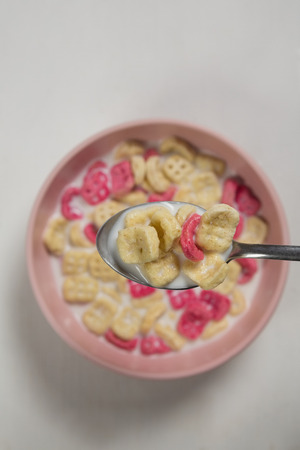 Close-up of honeycomb cereal and milk on white backgroundの写真素材