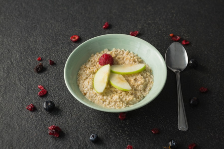 Fruit cereal in bowl on a concrete backgroundの写真素材