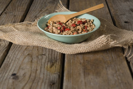 Bowl of oatmeals on wooden tableの写真素材