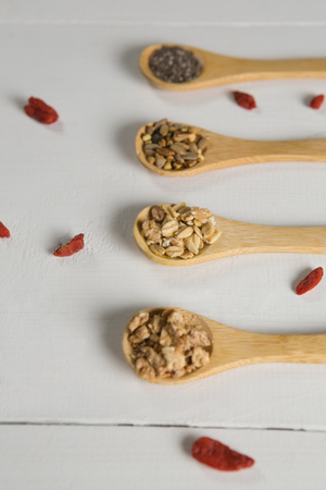 Close-up of various oatmeal in wooden spoonの写真素材