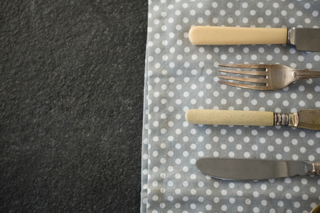 High angle view of cutlery on napkin at tableの写真素材